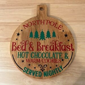 North Pole bed and breakfast Christmas charcuterie board sign